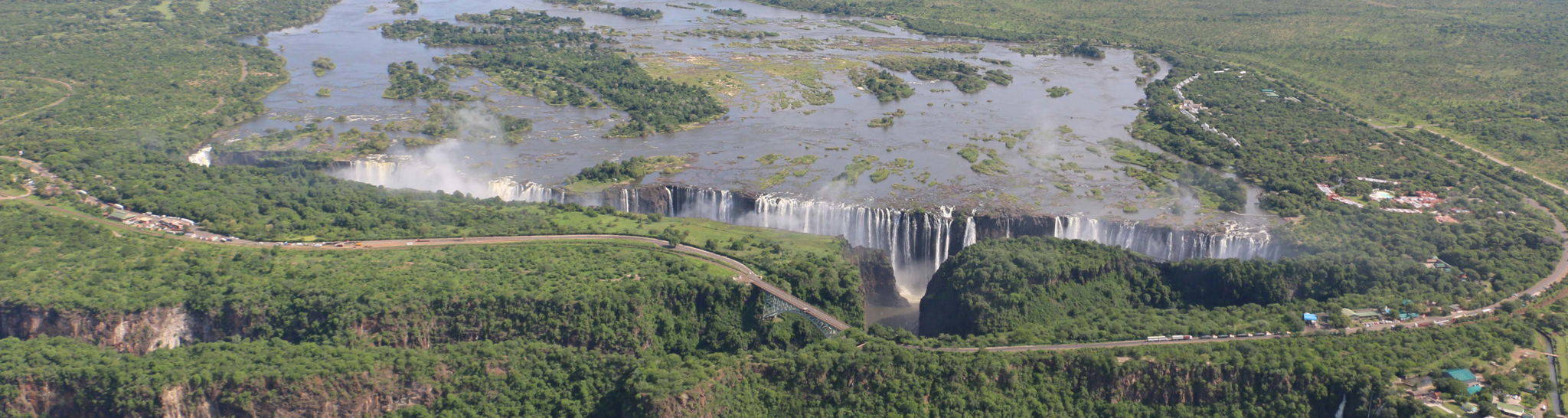 full width dry season ariel view of limited flow of Victoria falls Zimbabwe