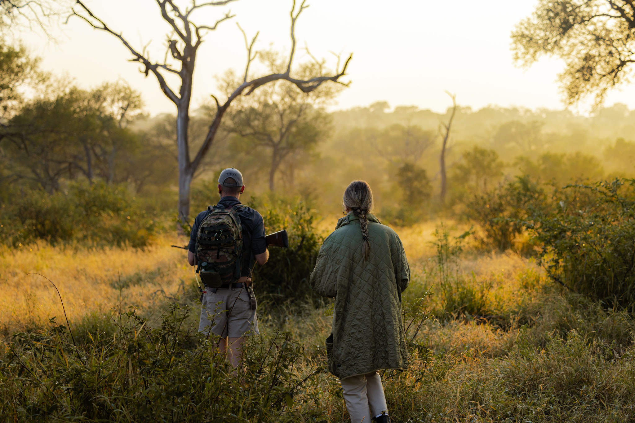 Guest with guide early morning in bush by Thornybush Game Reserve