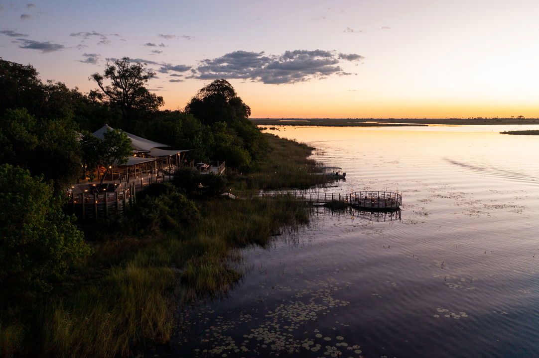 sunset aerial view of wilderness duma tau camp botswana