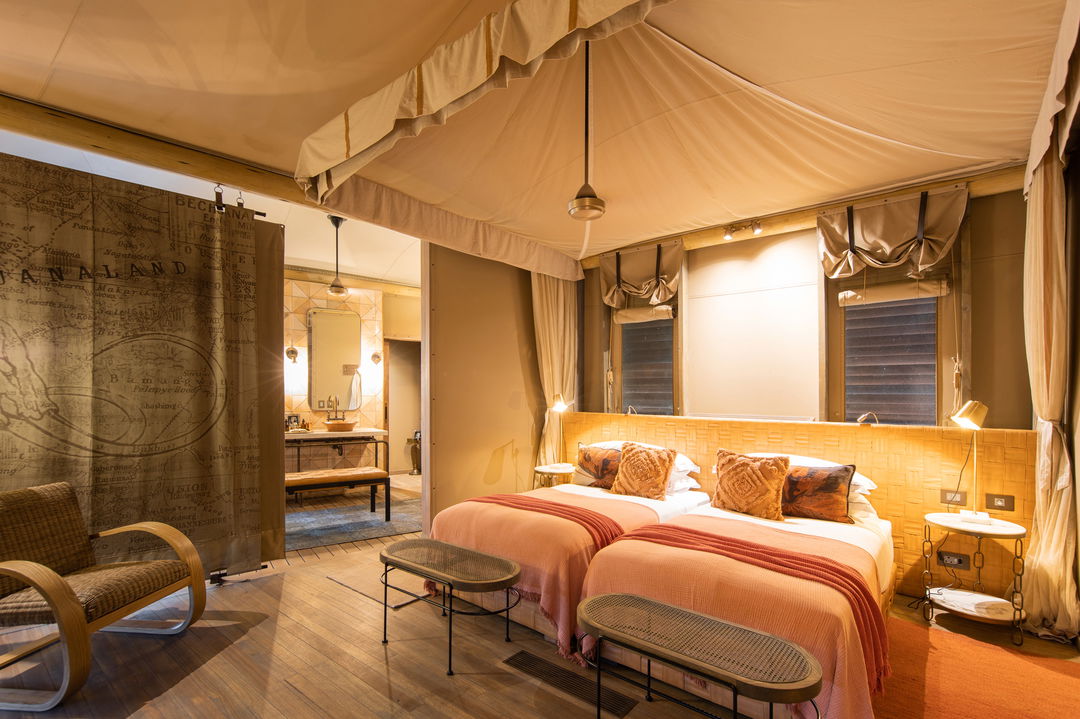 interior of suite with beds at wilderness duma tau camp botswana