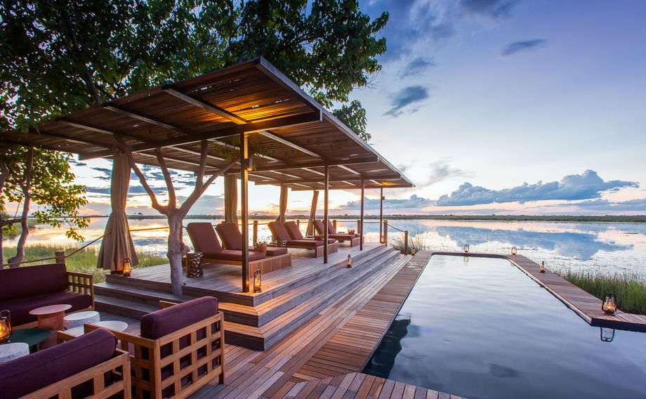 view of the pool and deck at osprey retreat of wilderness duma tau camp botswana