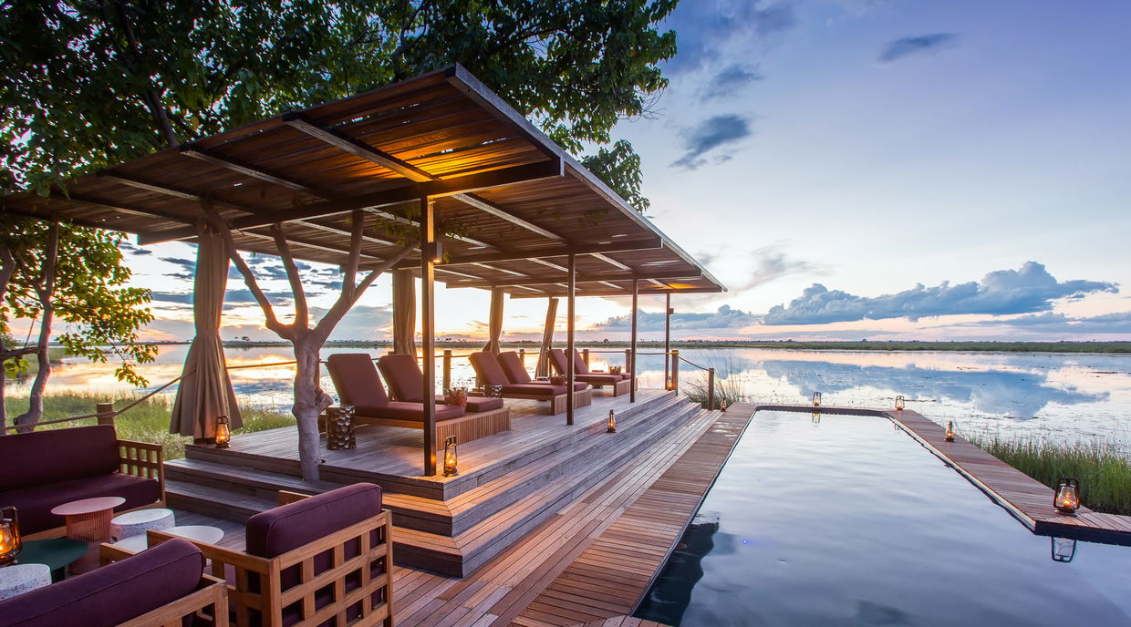 view of the pool and deck at osprey retreat of wilderness duma tau camp botswana