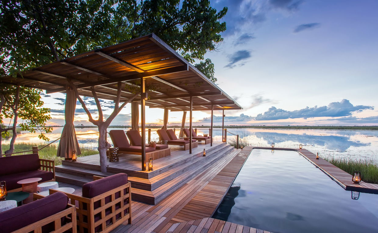 view of the pool and deck at osprey retreat of wilderness duma tau camp botswana