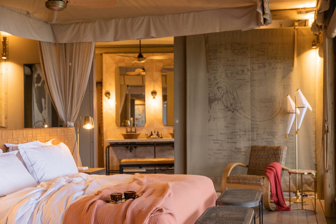 interior view of a bedroom in a standard suite of at wilderness duma tau camp botswana