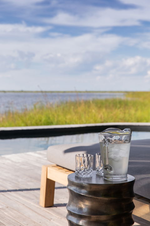 view of splash pool from deck at at wilderness duma tau camp botswana