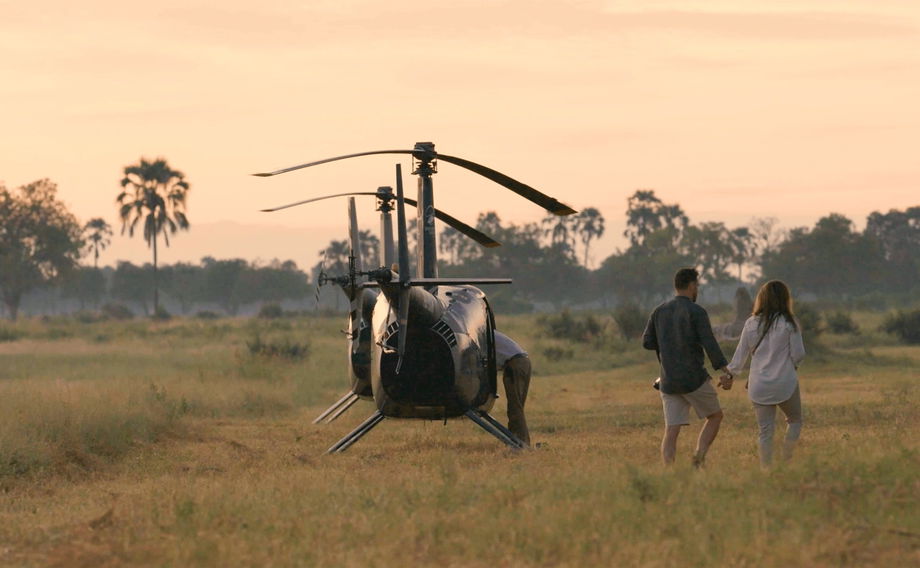 two guests at little Mombo Wilderness Okavango delta next to helicopters grounded two guests at little Mombo Wilderness Okavango delta next to helicopters grounded