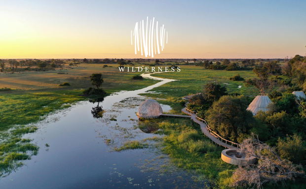 aerial view of wilderness Jao Camp in Okavango delta with logo overlay aerial view of wilderness Jao Camp in Okavango delta with logo overlay