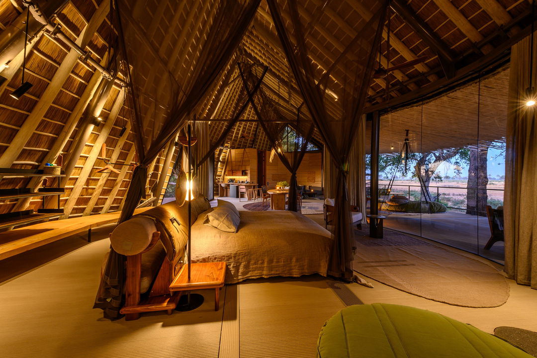 side view of luxury bedroom and deck at Jao Camp Wilderness Botswana