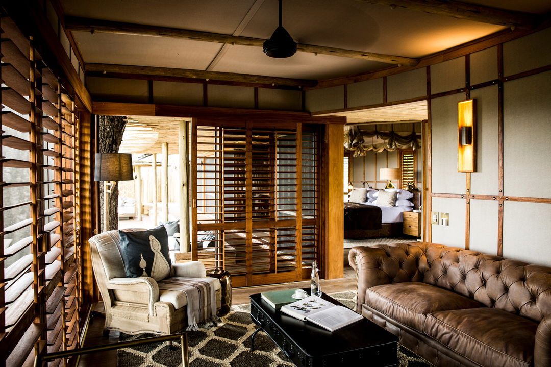 lounge area of suite at Little mombo camp wilderness