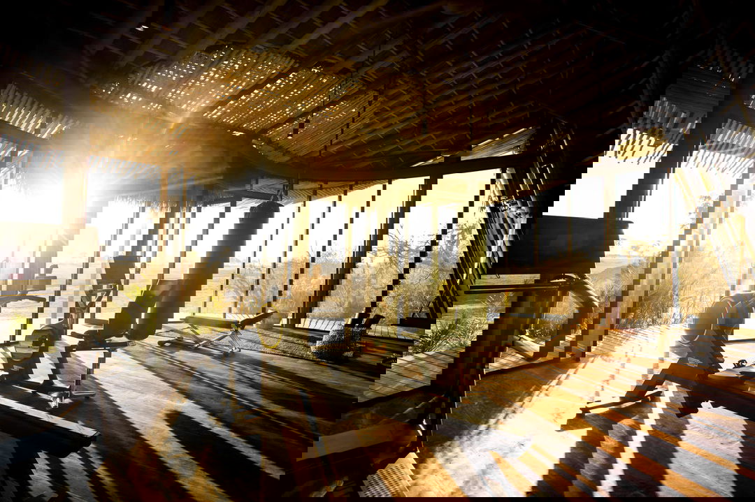 gym facilities with equipment and sun rays coming in at Jao Camp Wilderness Okavango Delta Botswana