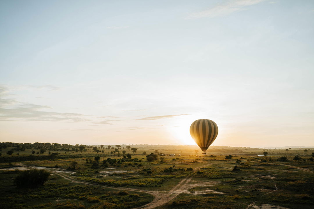 hot air balloon over the plains in the morning by Wilderness Usawa tented camp Serengeti