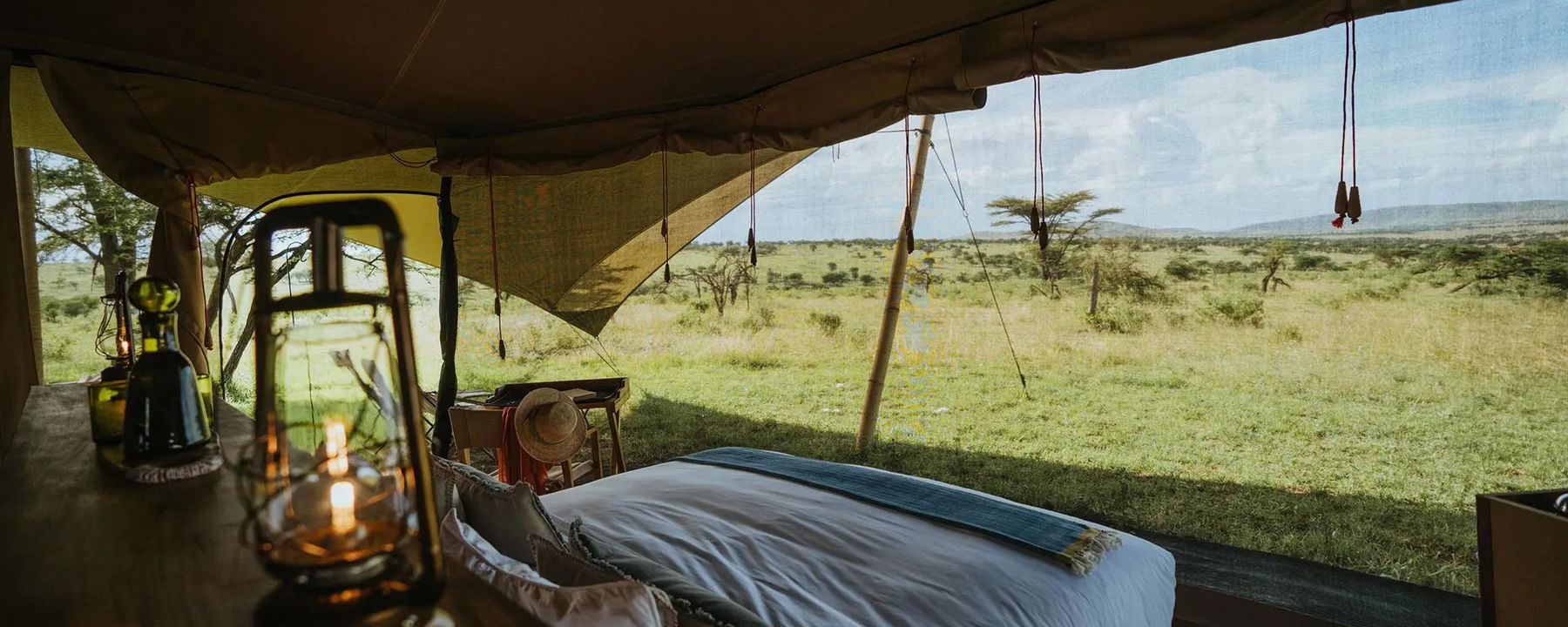 bedroom inside with a view at Wilderness Usawa tented camp Serengeti