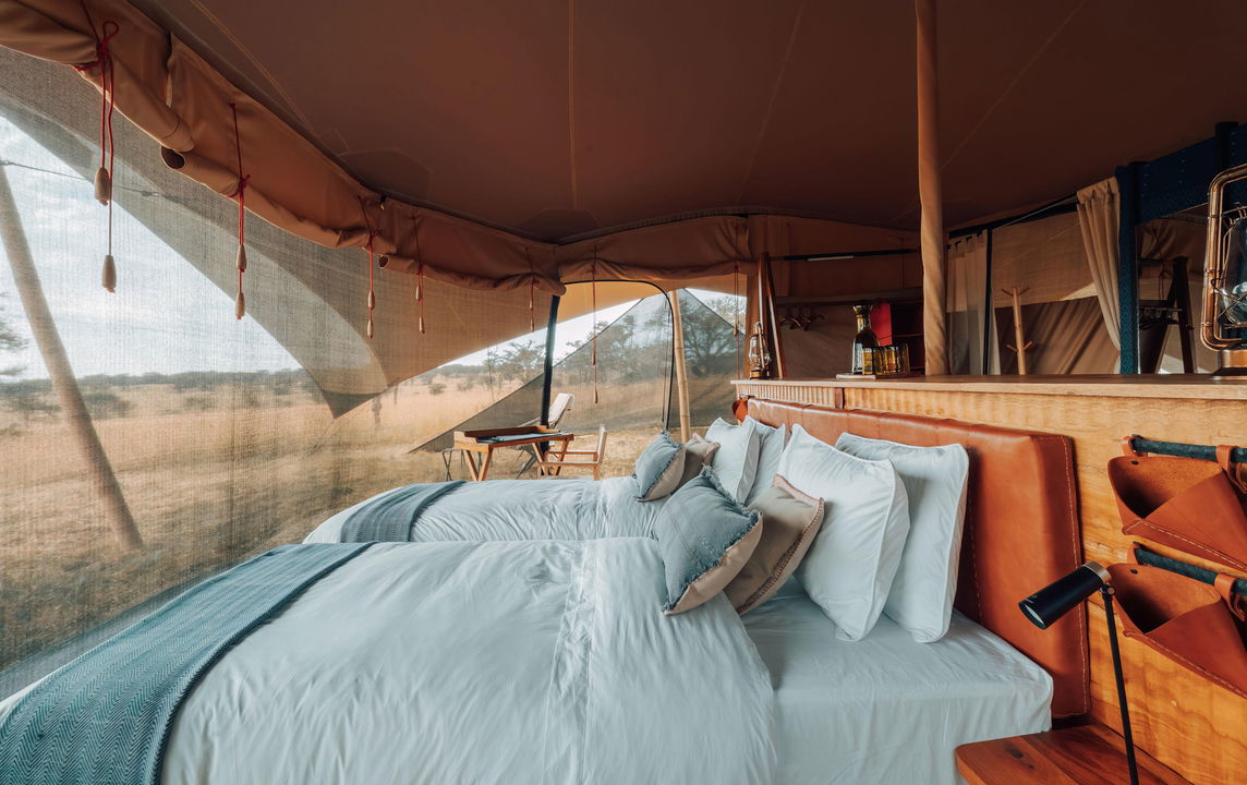inside a bedroom of a suite by Wilderness Usawa tented camp Serengeti