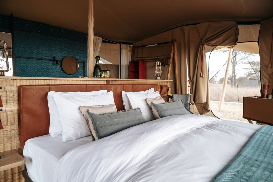 inside a bedroom of a tented suite at Wilderness Usawa tented camp Serengeti