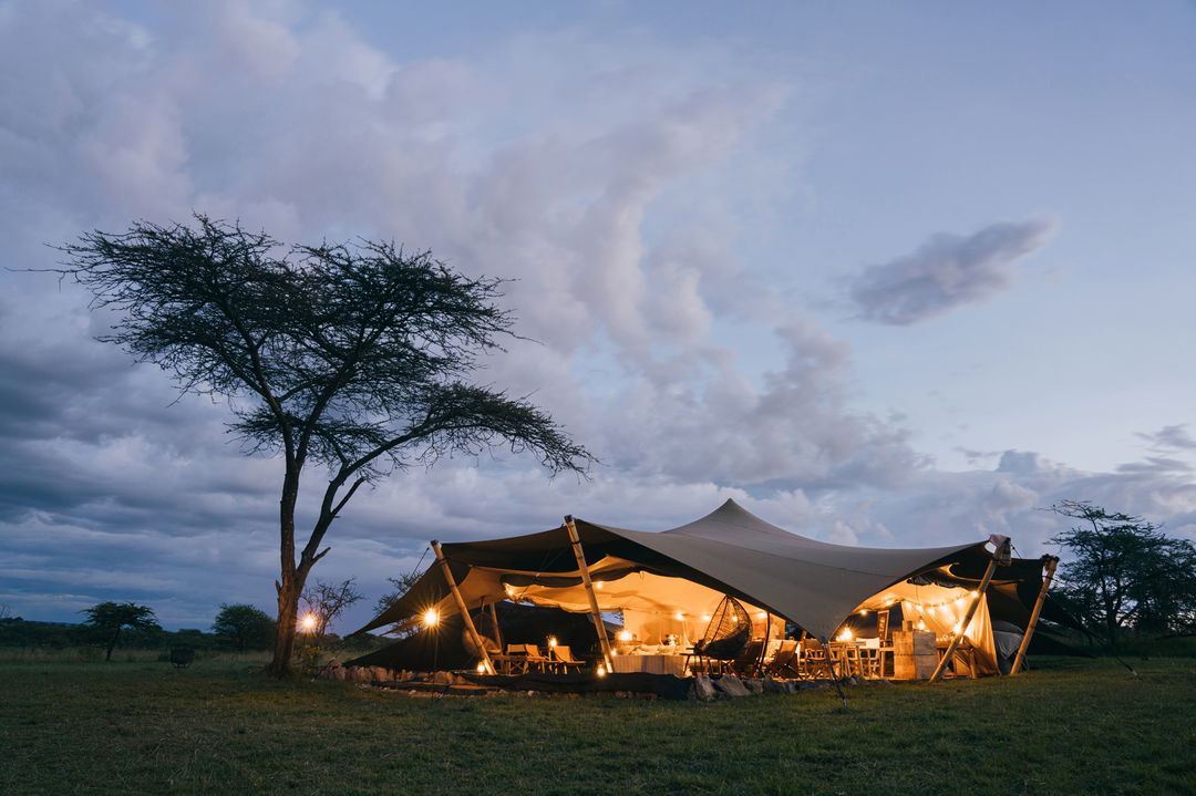 exterior view of Wilderness Usawa tented camp Serengeti at sunset