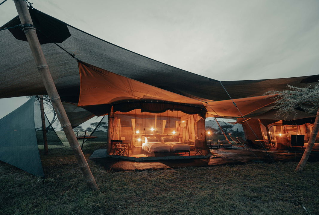 evening exterior view of family tent at Wilderness Usawa tented camp Serengeti