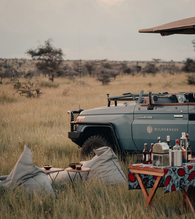 sundowners set up by safari vehicle of Wilderness Usawa tented camp Serengeti