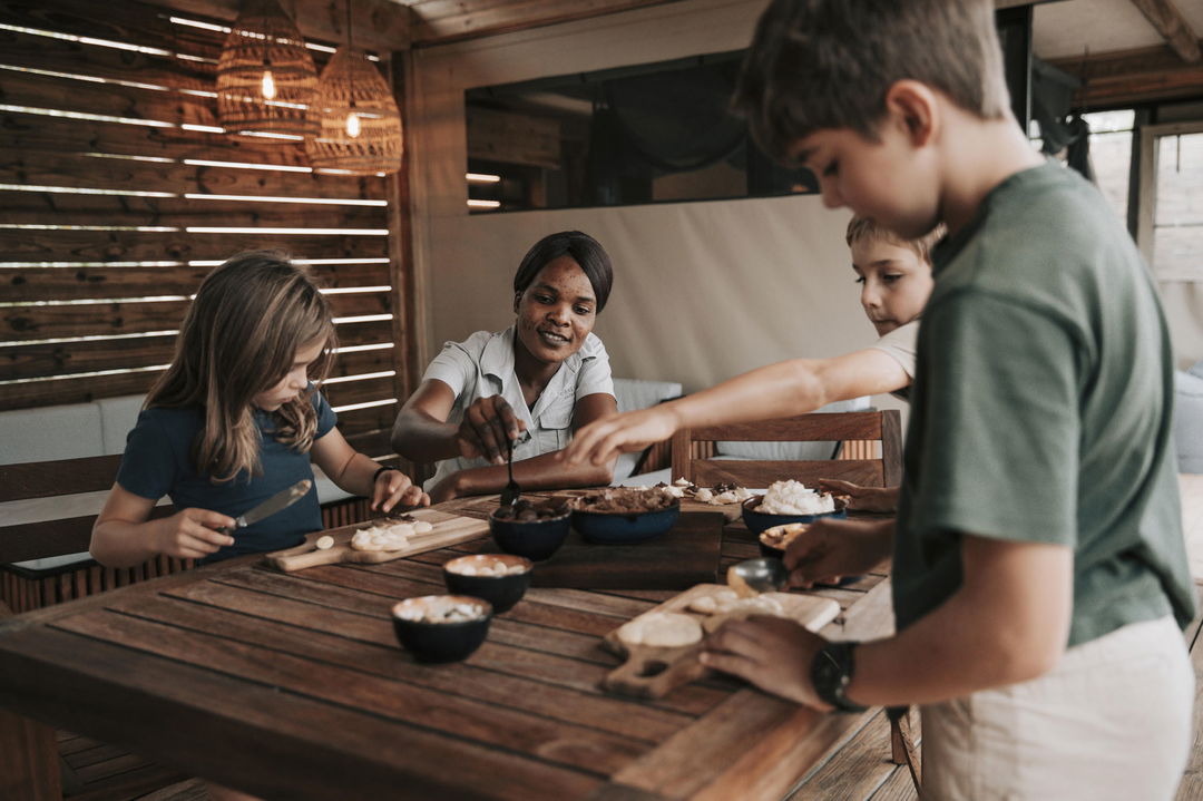 kids making pizza at Vumbura Plains Camp Wilderness Okavango Delta