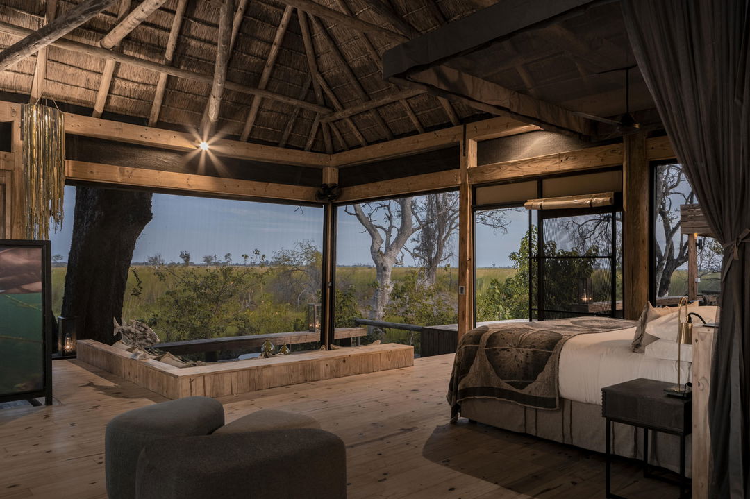 interior view of safari room with splash pool and patio at Vumbura Plains Camp Wilderness Okavango Delta