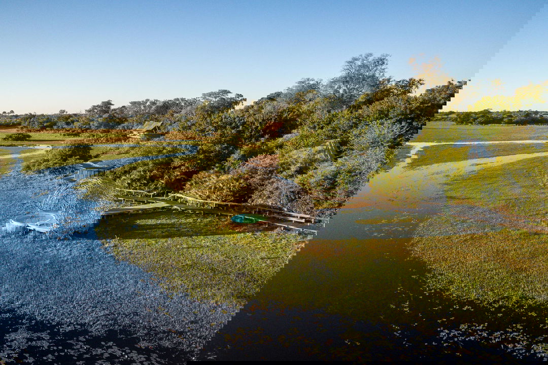 aerial view of Jao Camp Wilderness with waterways of delta in foreground