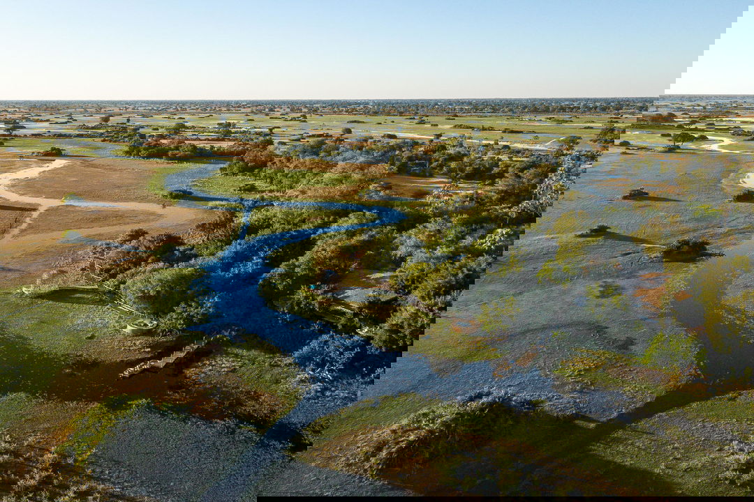 aerial view of Jao Camp Wilderness with waterways of delta in foreground