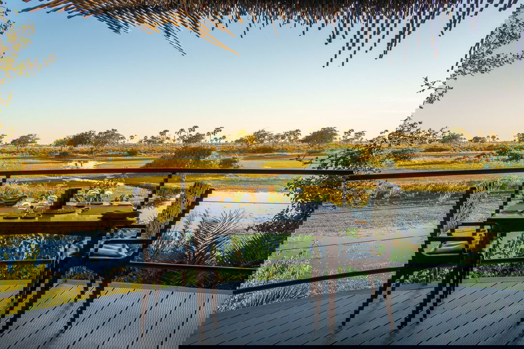 table set on deck for breakfast at Jao Camp Wilderness Okavango Delta Botswana