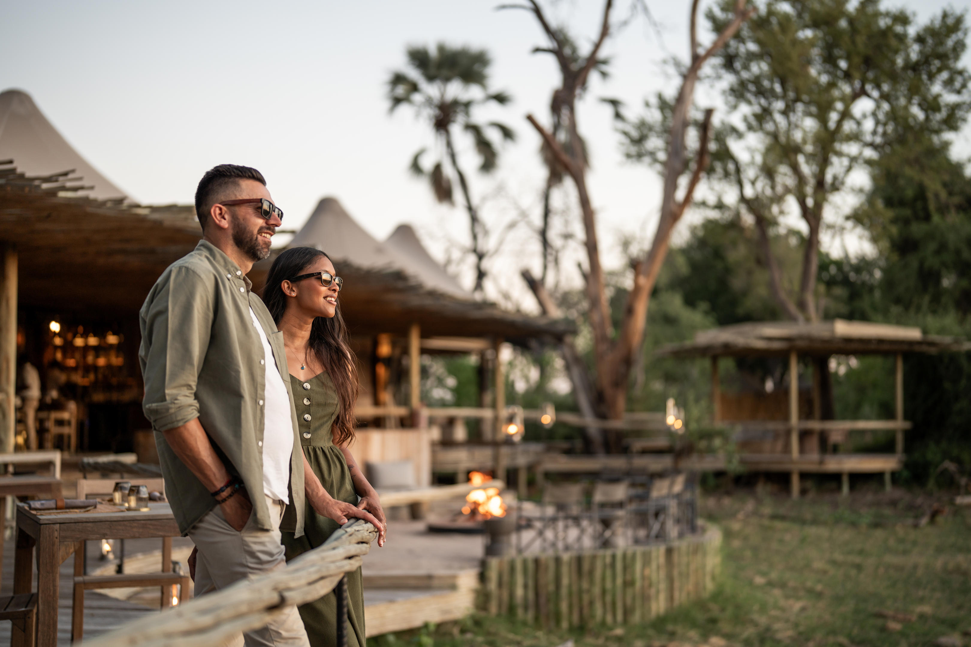 guests on viewing deck of mombo camp looking at delta