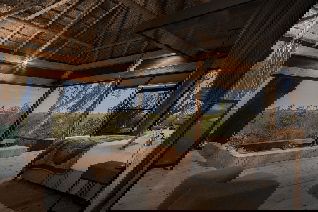 interior view of safari room with splash pool and patio at Vumbura Plains Camp Wilderness Okavango Delta