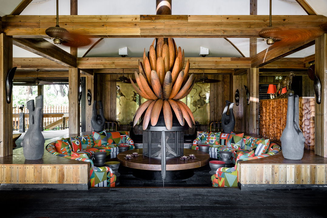 inside fire pit with couches at lounge of Xigera Lodge Botswana