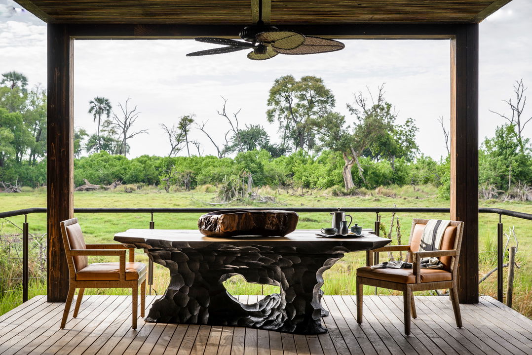 patio furniture of main lodge deck at Xigera Lodge Botswana