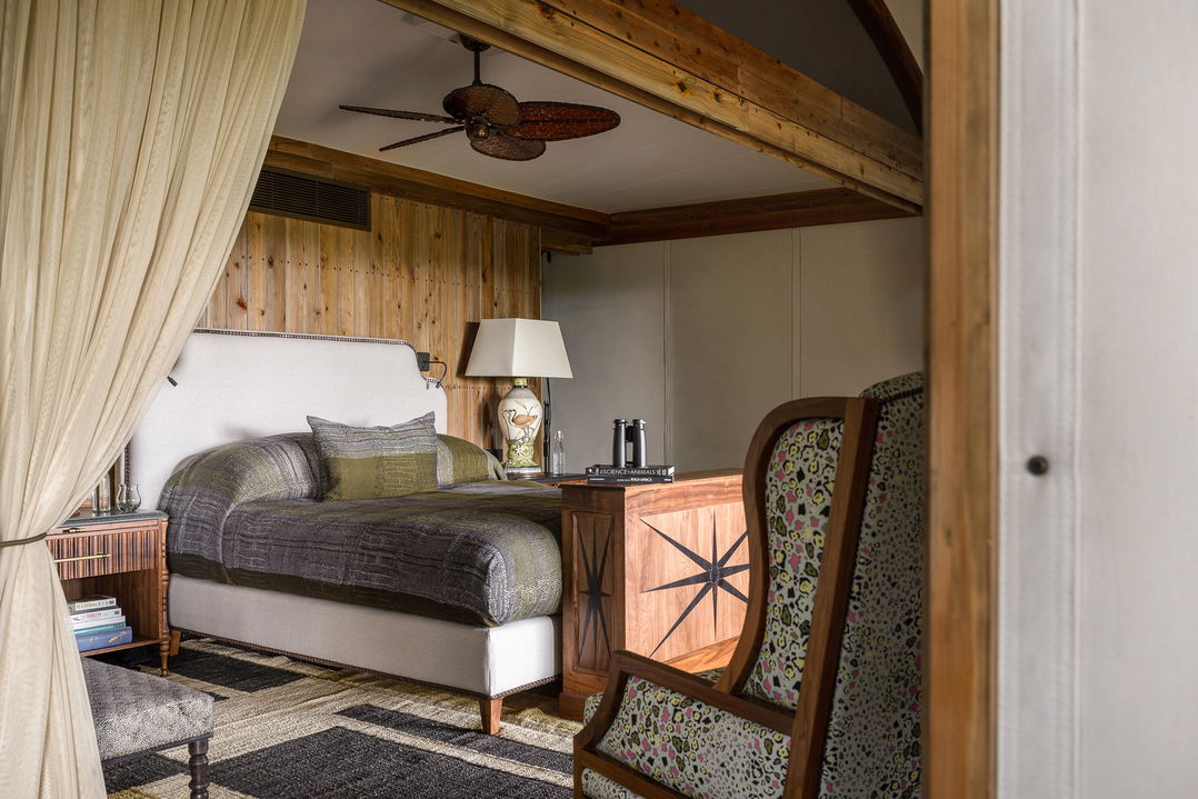 view of bed in bedroom of sausage tree suite at Xigera Lodge Botswana