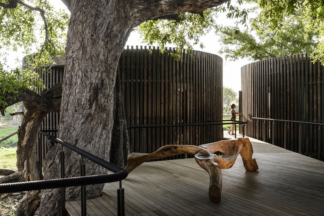 view of outdoor showers on deck of Xigera Lodge Botswana