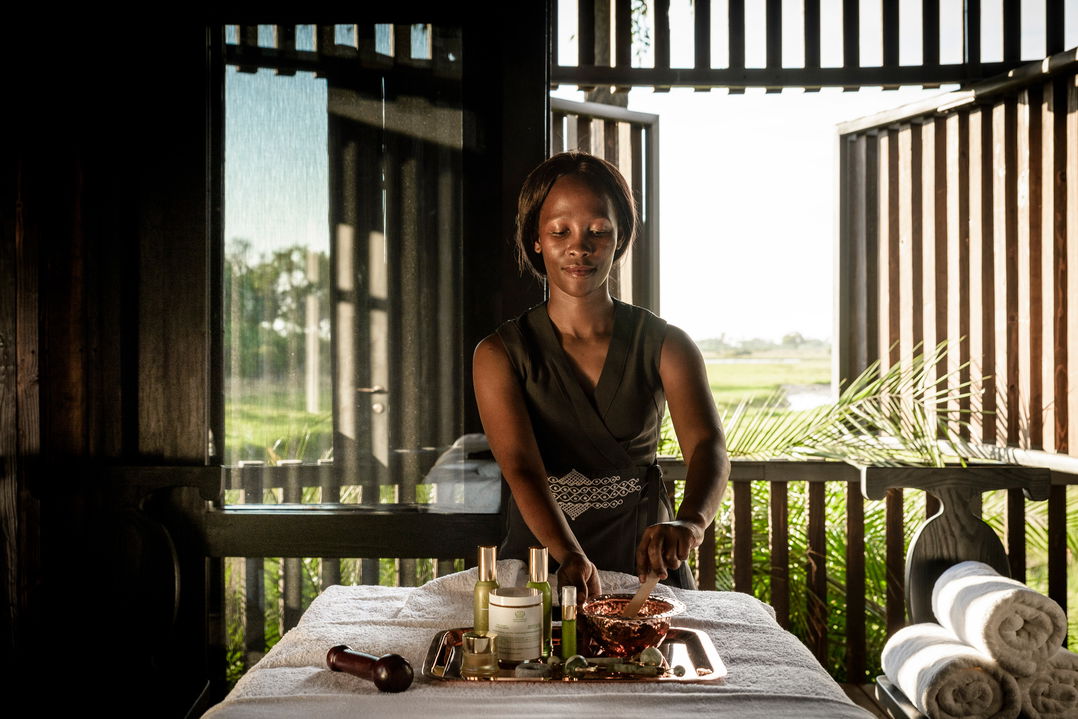 lady staff in spa of Xigera Lodge Botswana getting ready for guests