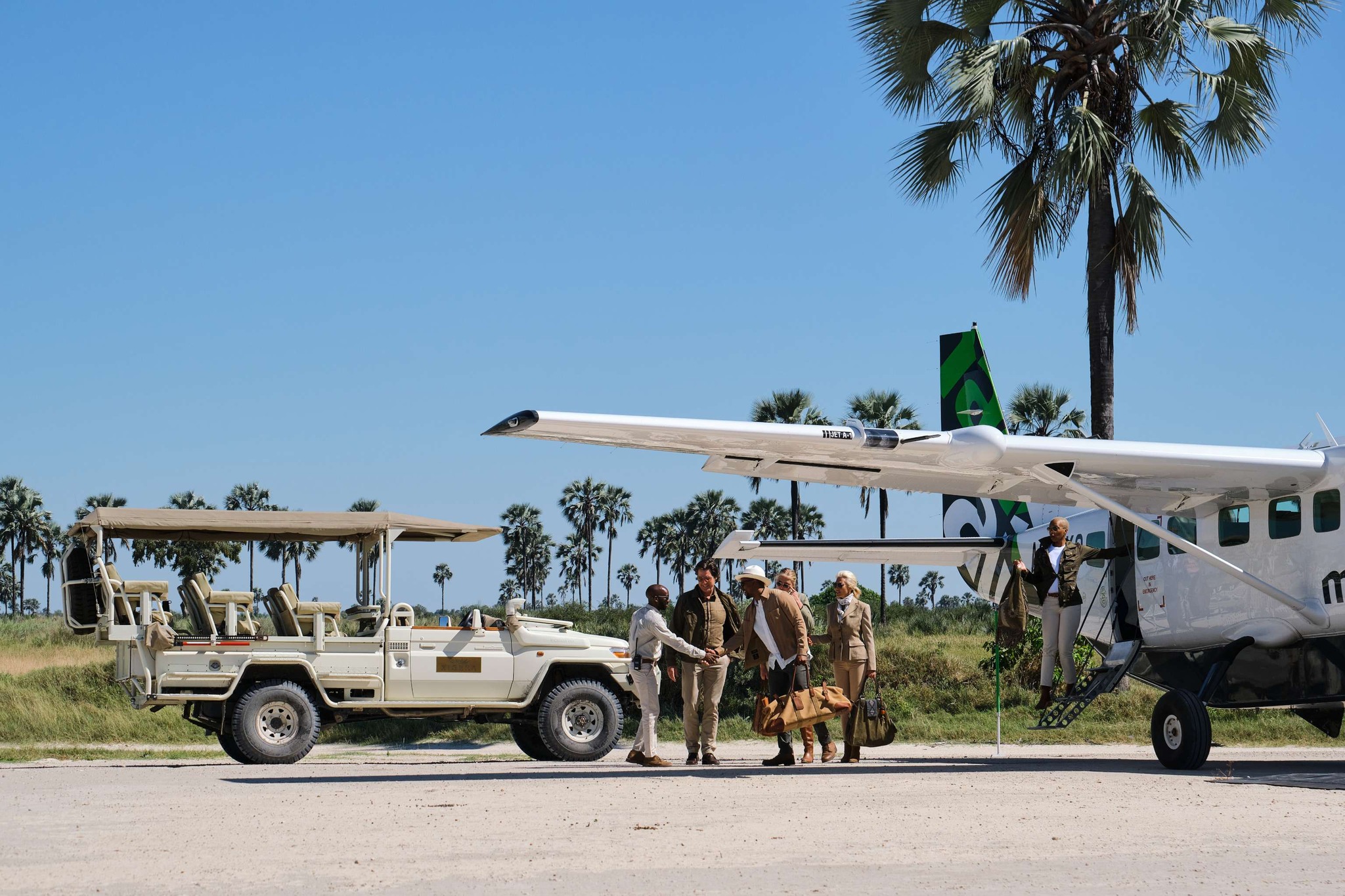 guests on airstrip picked up for trasnfer to safari lodge xigera