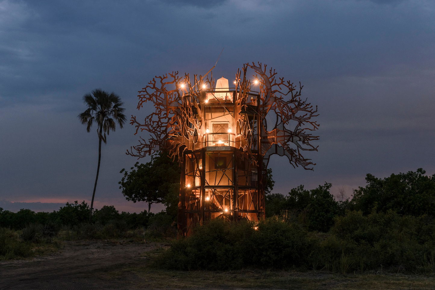 Xigera tree house on Okavango delta at night illuminated