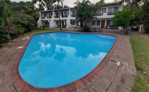 All flats are on ground floor, in front of pool.