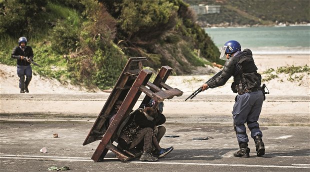 Justin Sullivan, Stenin Exhibition, Chavonnes Battery Museum, Protesters in Hout Bay, Cape Town Justin Sullivan, Stenin Exhibition, Chavonnes Battery Museum, Protesters in Hout Bay, Cape Town