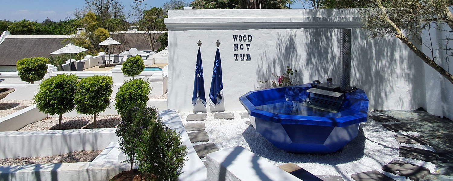 KolKol wood fired hot tub pool area healing and wellness spa at 5 star De Kloof Luxury Estate boutique hotel and spa Swellendam Western Cape South Africa