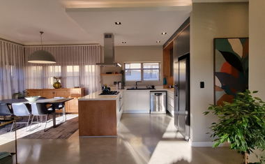 Open-plan kitchen and lounge at 10 Whale Rock Gardens, Plettenberg Bay