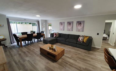Open-plan lounge and dining area at 2 Greenpoint Mews, Plettenberg Bay