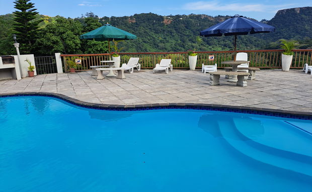 Pool deck with views of the Umtamvuna Mountains