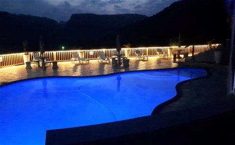 Sparkling pool at night with amazing views