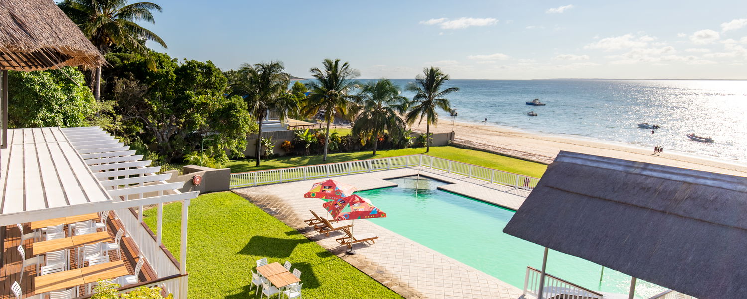 Bird's view of pool, lawns, beach and ocean!