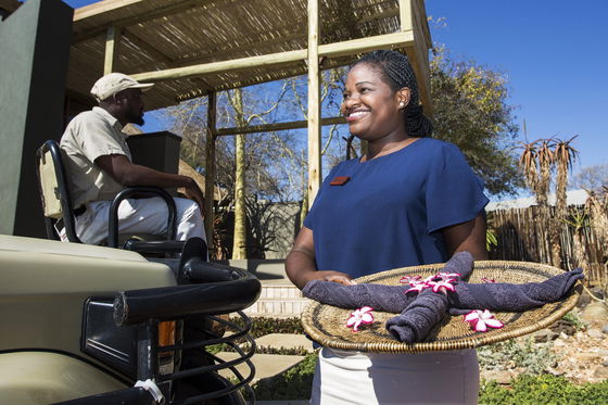 Greeting guests back from game drive with refreshing cold towels