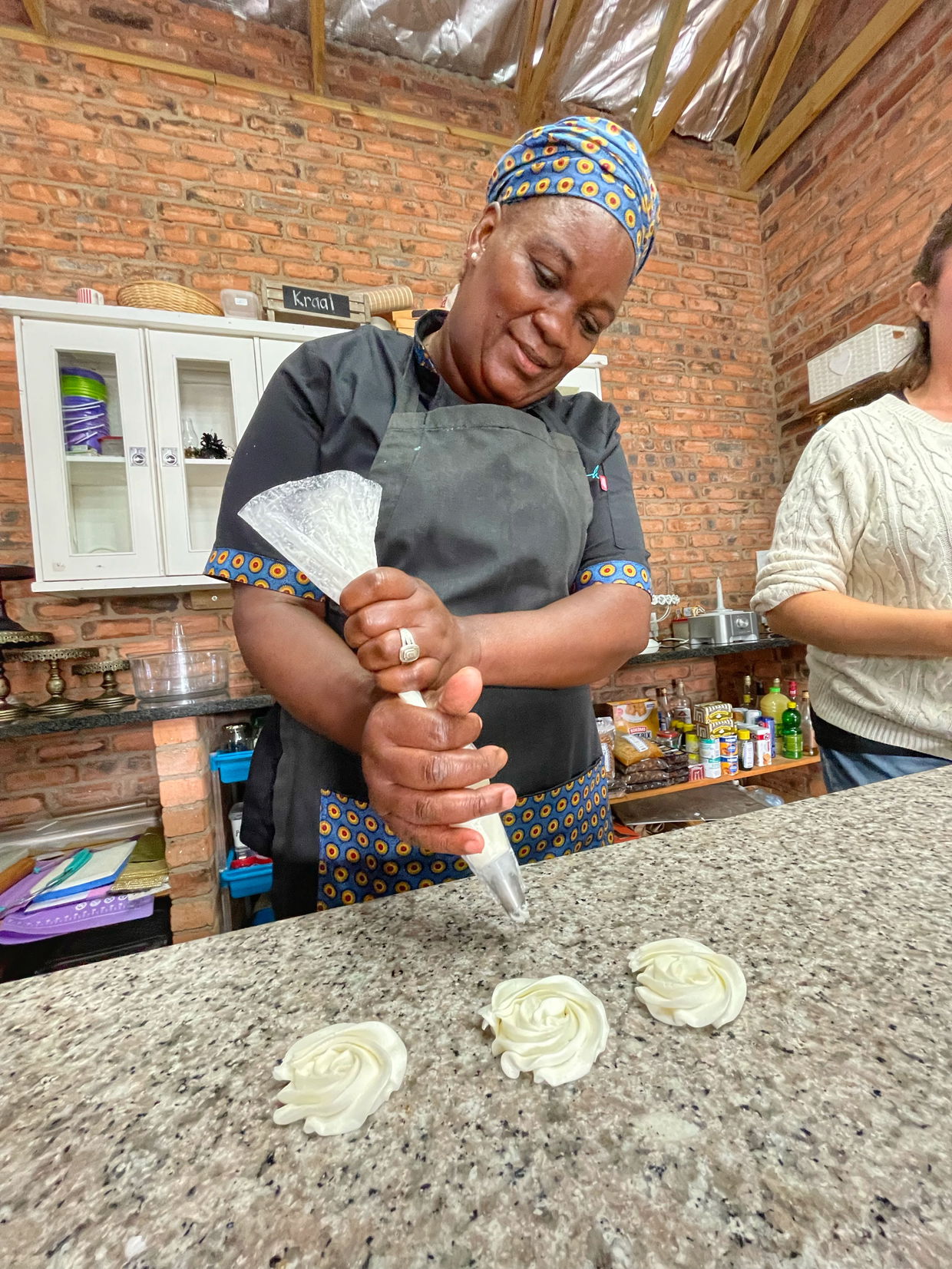 Ntokozo learning new piping techniques