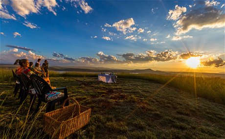 Sundowners at Three Tree Hill overlooking Drakensberg mountains